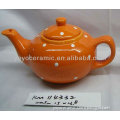 orange ceramic tea pot